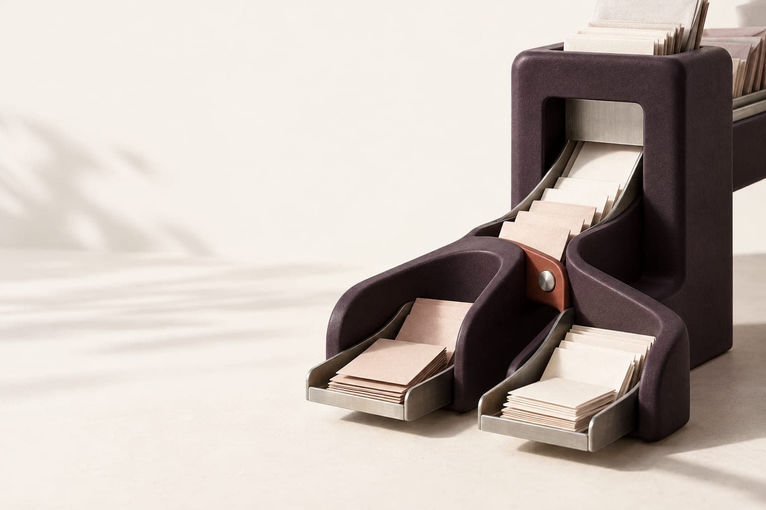 Plum ceramic routing sculpture with paper slips branching into two channels.